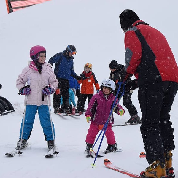 a family learns how to ski at woodbury ski area