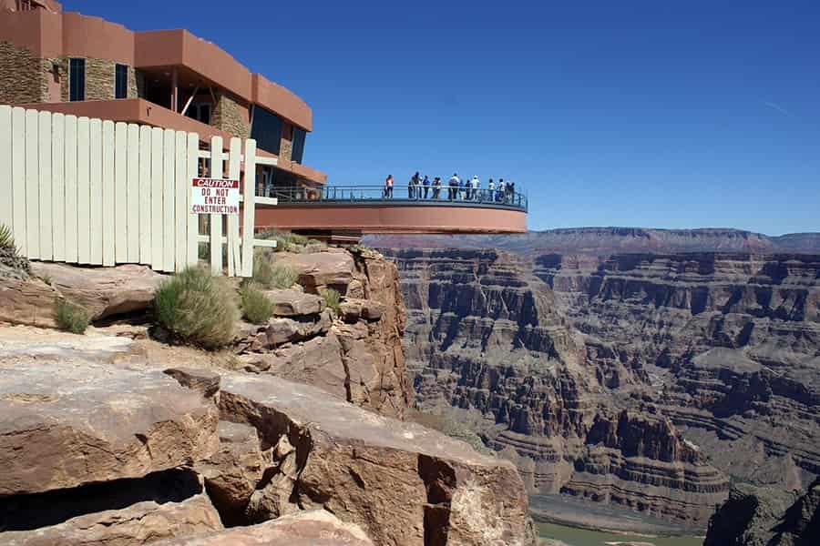 people observing the grand canyon on a skywalk