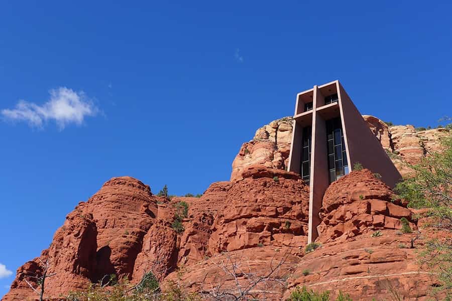the chapel of the holy cross on top of a cliff