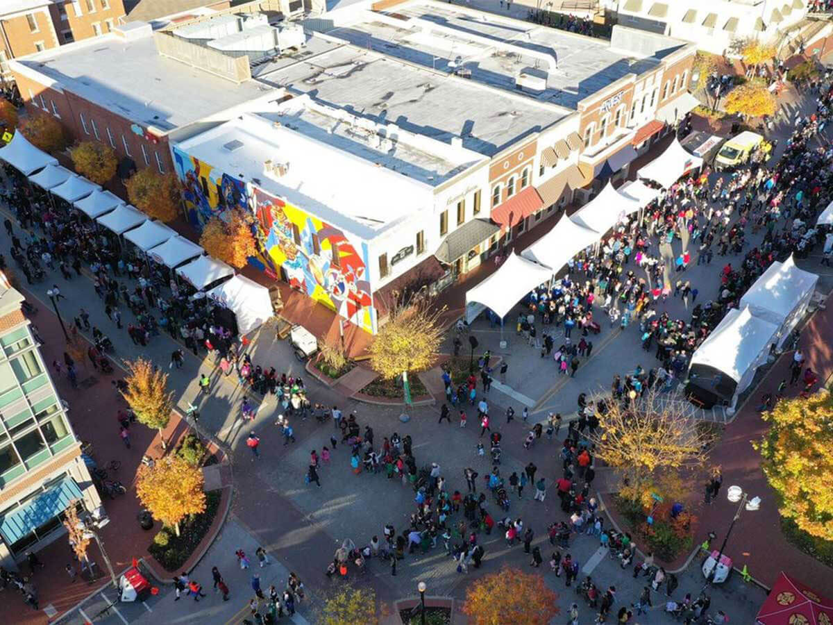 an overhead view of the walmart museum during a street festival