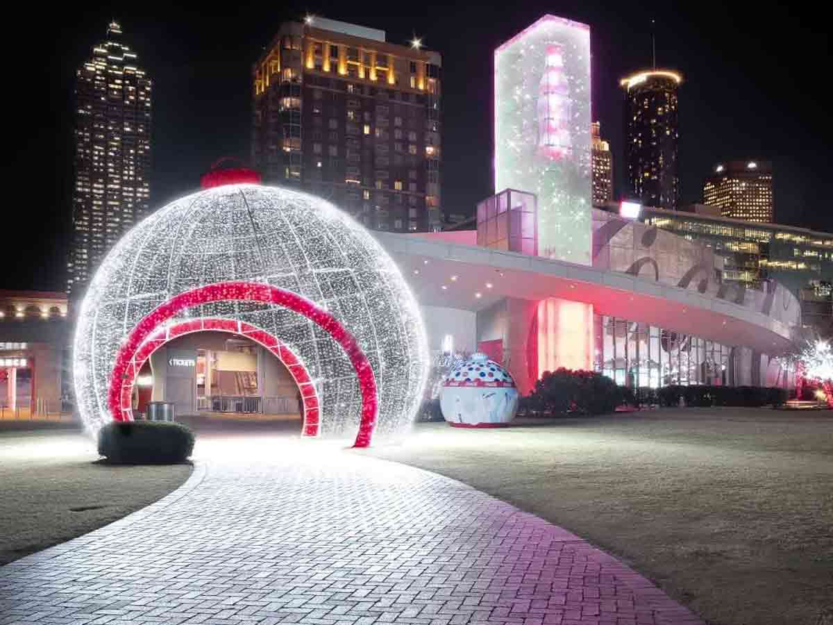 a larger than life ornament and light show at the world of coca-cola in atlanta