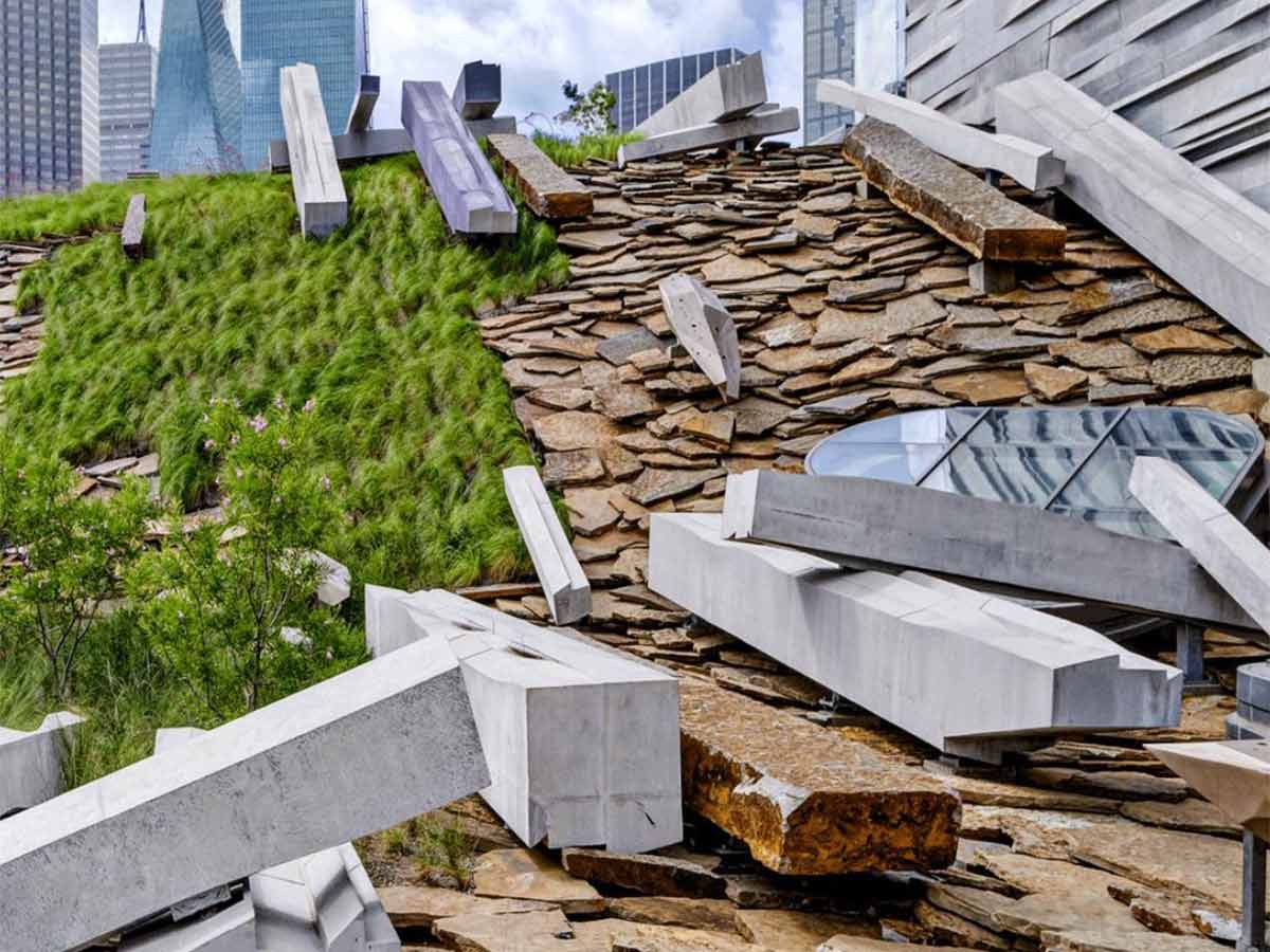 a portion of the roof of the perot museum of nature and science that has abstract grass and rock formations on it