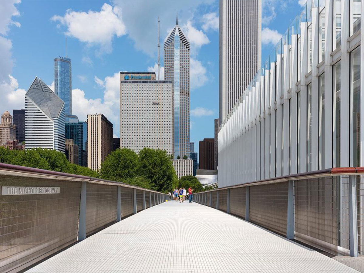a walking bridge from millennium park alongside the new wing of the art institute chicago