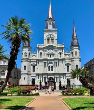 an exterior view of saint louis cathedral from jackson square in new orleans