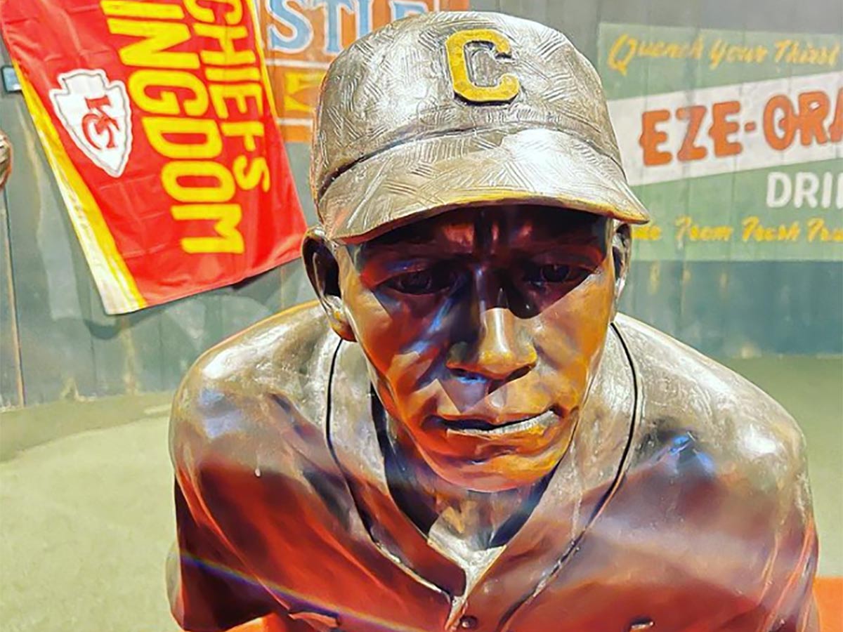 a statue of a player at the negro leagues baseball museum