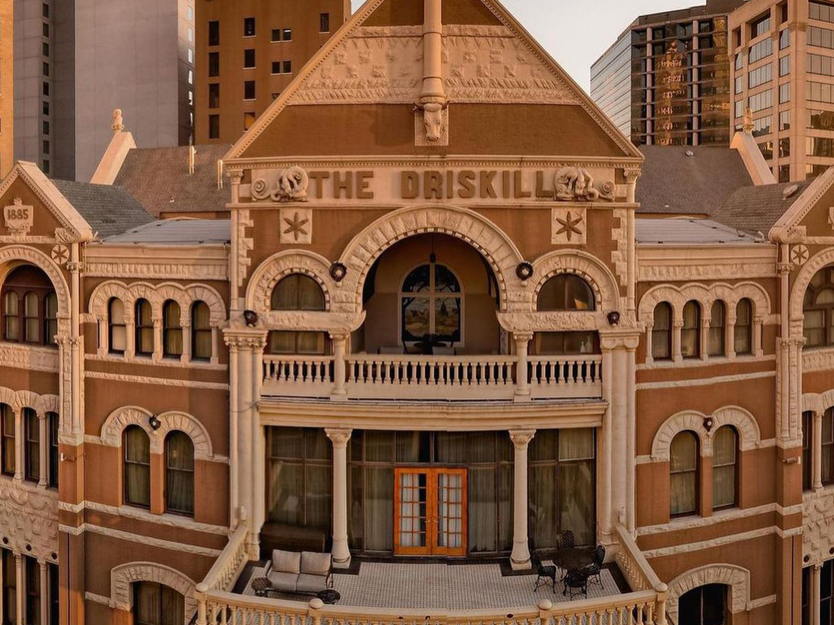 the exterior of the highly designed and historic driskill hotel in downtown austin