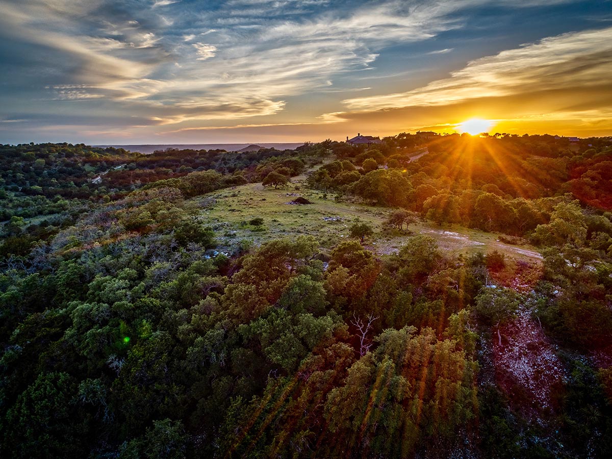 sunset on the horizon of a texas hill country landscape