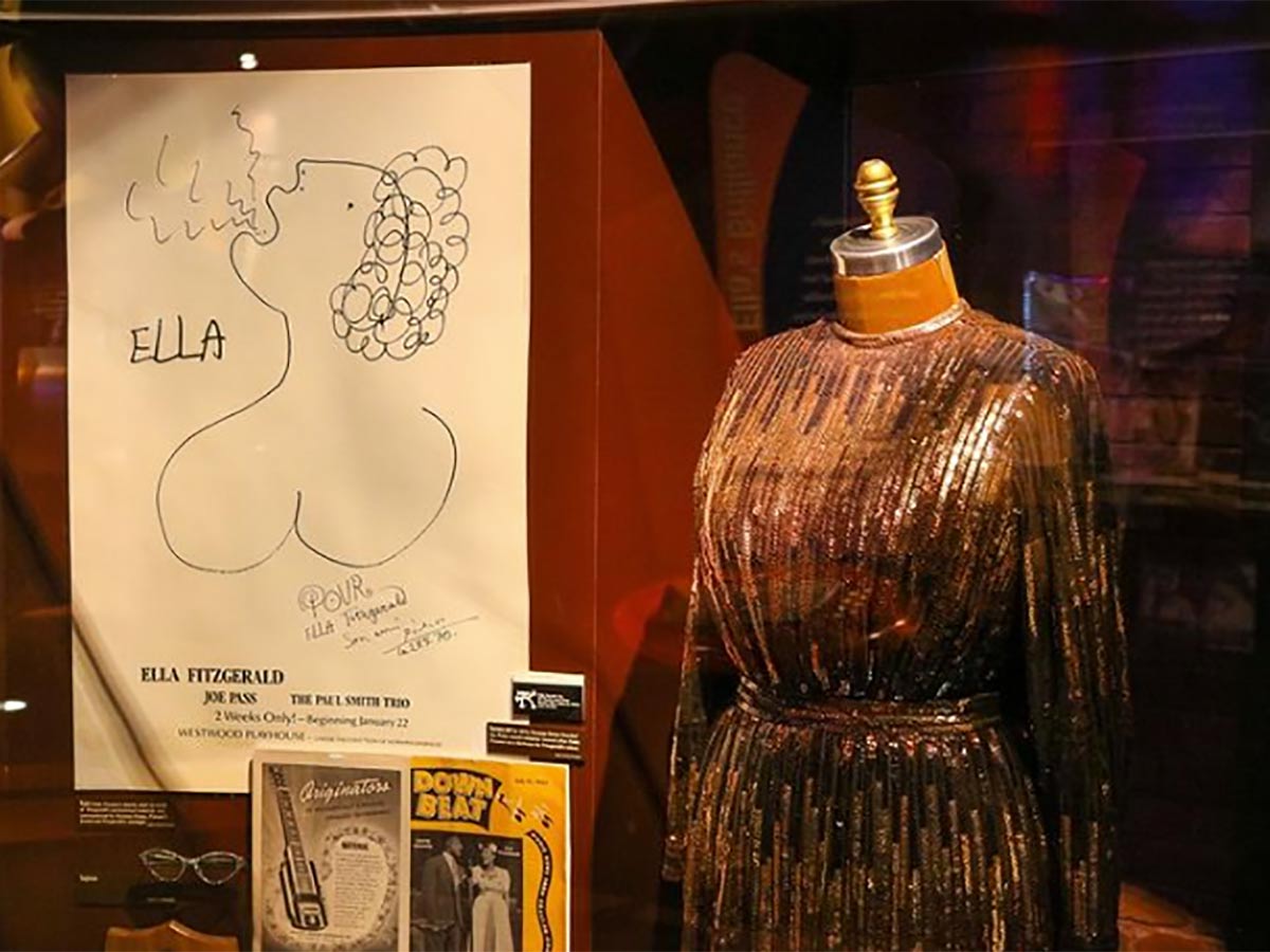 an exhibit display of ella fitzgerald clothes