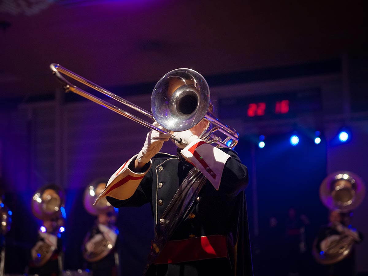 a trombone player on stage with a band