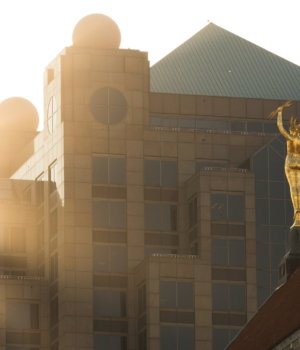 a golden statue of Miss Electra on top of the alabama power building in birmingham alabama