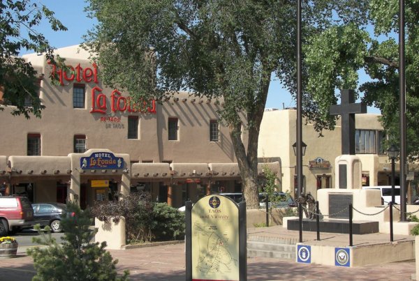 a view of downtown taos plaza in the sunshine