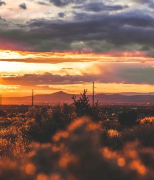 a sunset over an expansive new mexico landscape