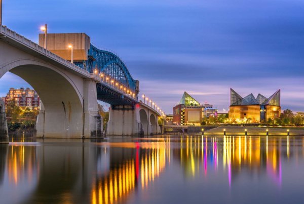 the historic chief john ross bridge in chattanooga over the tennessee river and downtown at night