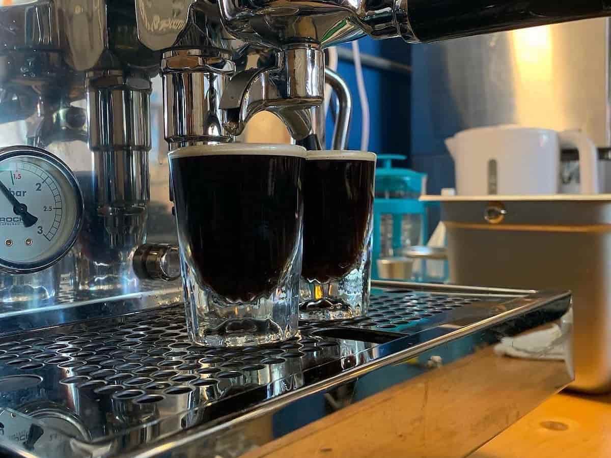 two espresso shots below the machine at indigo blue coffeehouse in pine bluff arkansas