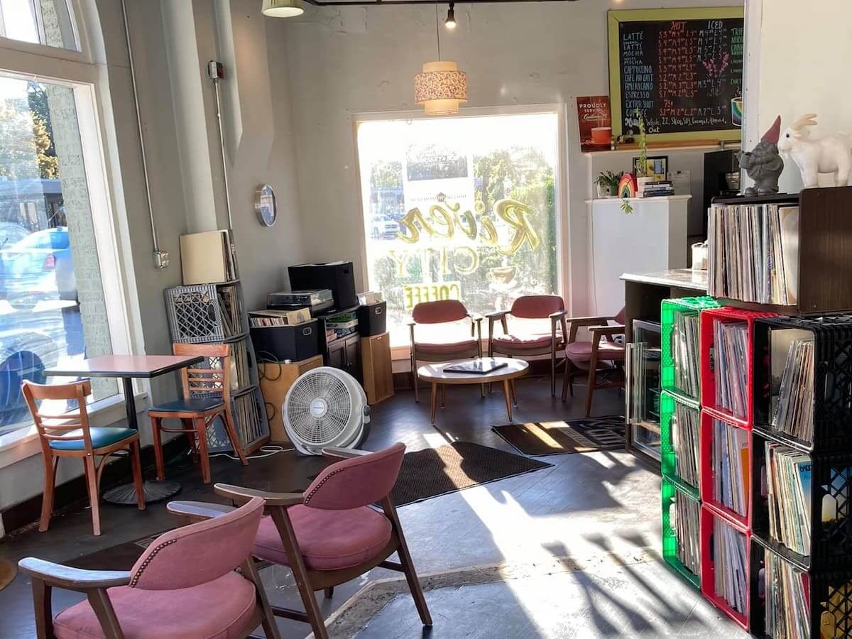 the interior of river city coffee in little rock with its large vinyl record collection