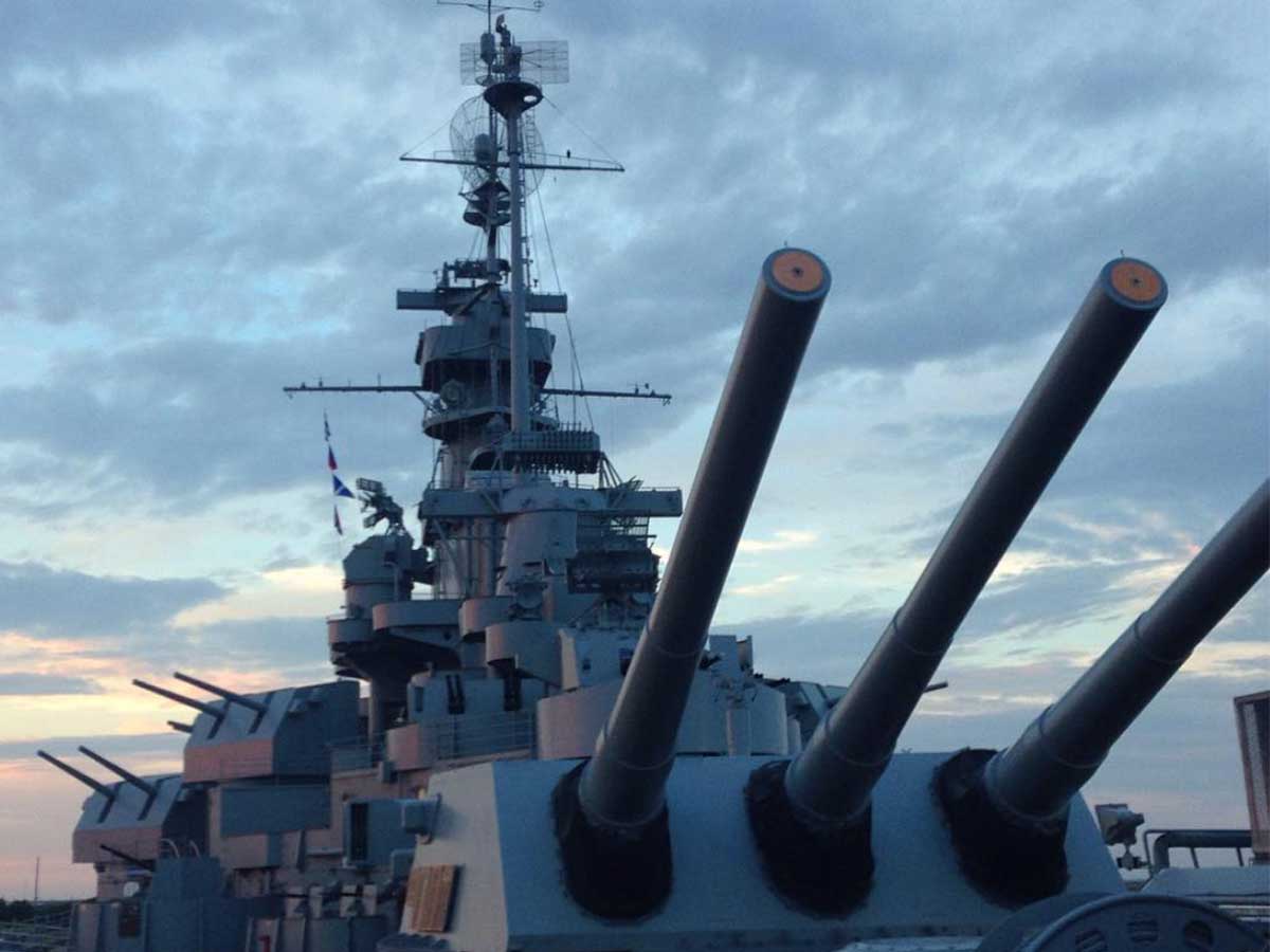 the tower and cannons on top of the USS Alabama battleship museum