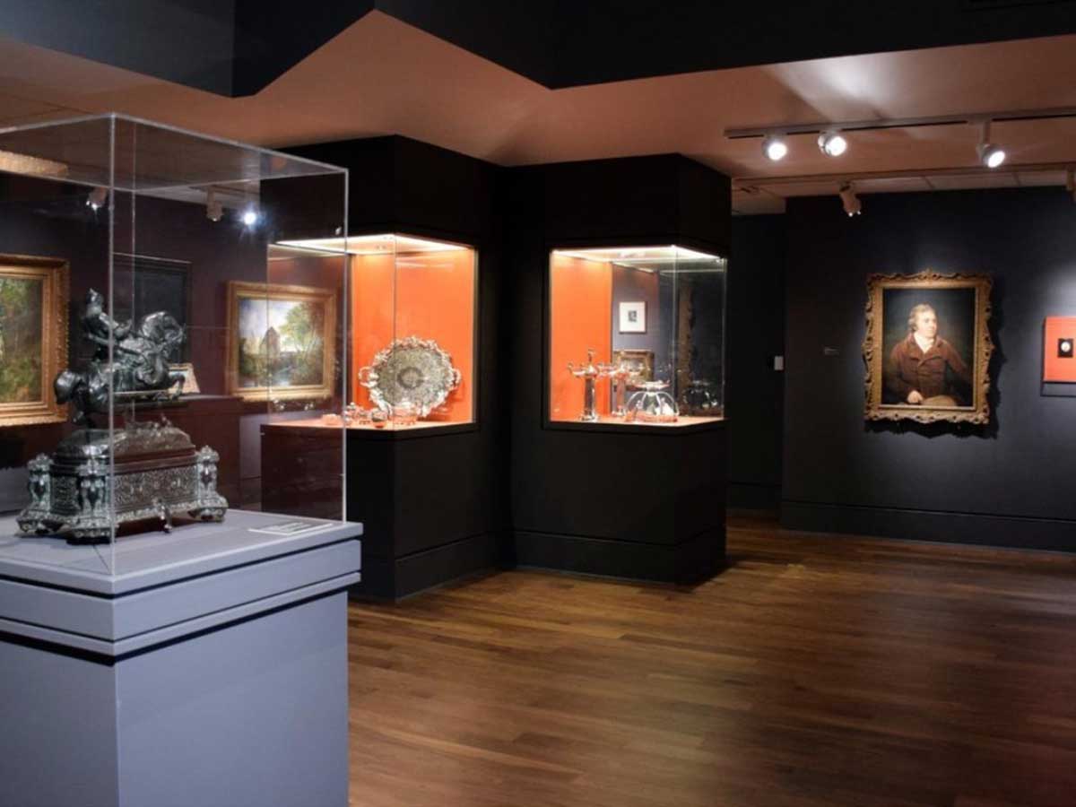a gallery room at the mobile museum of art filled with artifacts and artwork