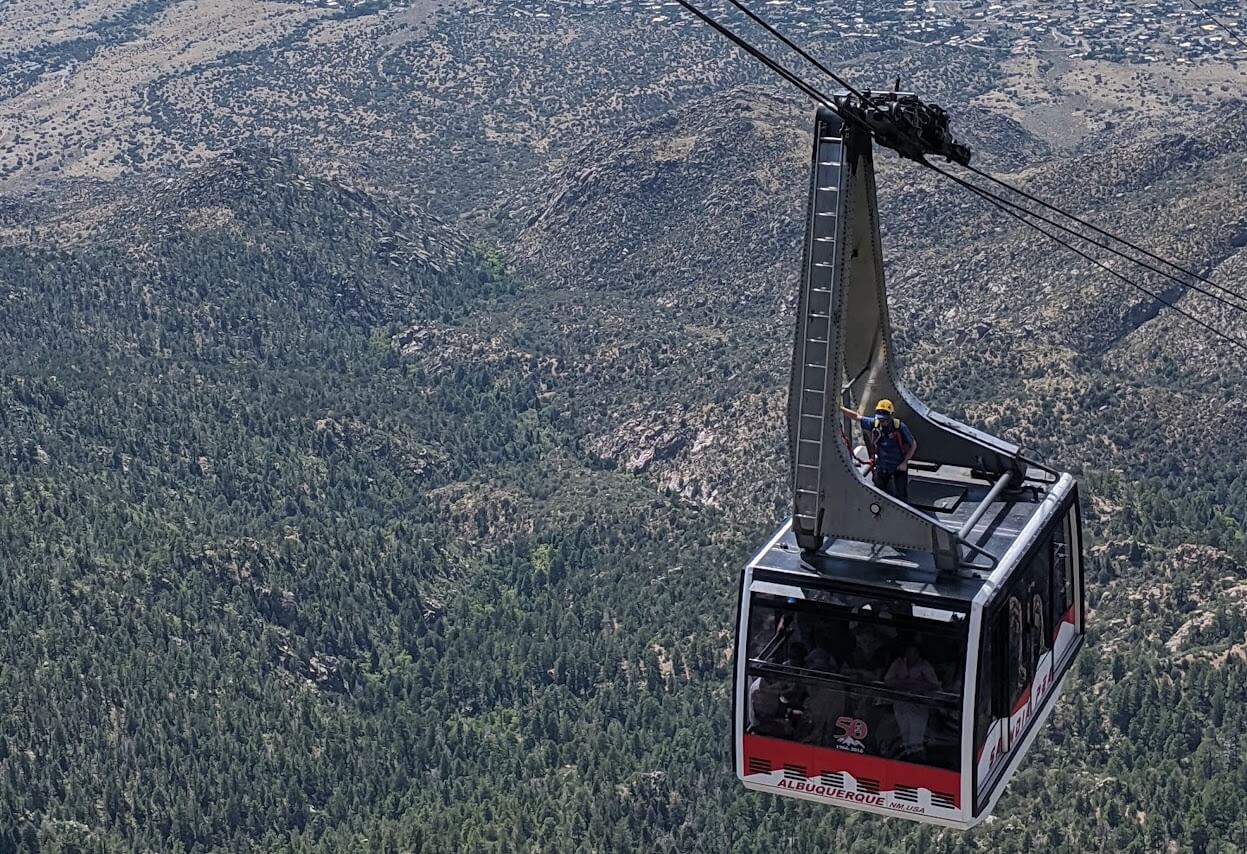 the sandia peak tramway climbing up the cable to the top of the peak