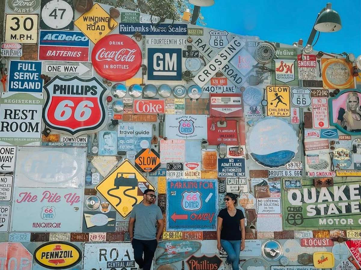a wall covered in historic route 66 signs from a historic neighborhood in albuquerque new mexico
