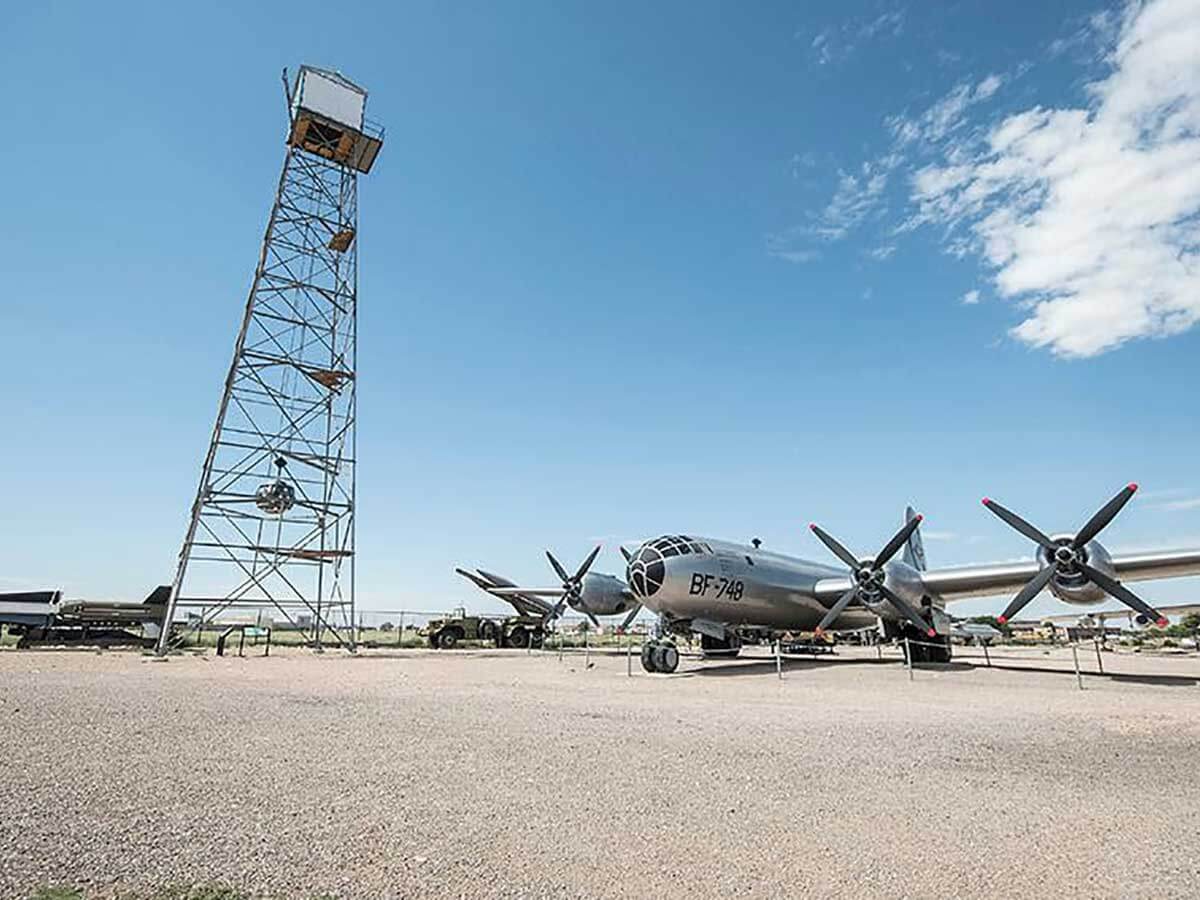 a historic plane and watch tower at the national museum of nuclear science and history in Albuquerque