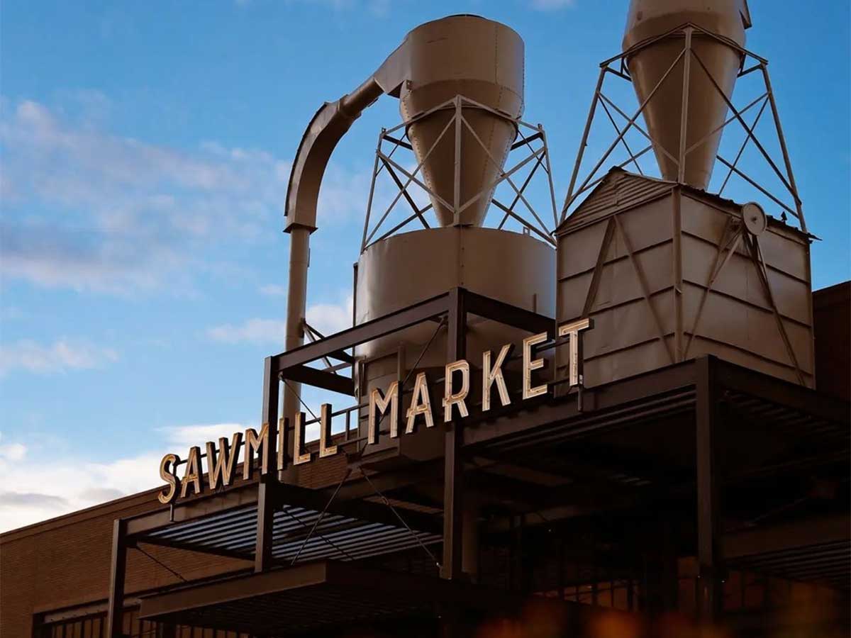 the exterior of sawmill market in albuquerque prominently featuring former grain silos