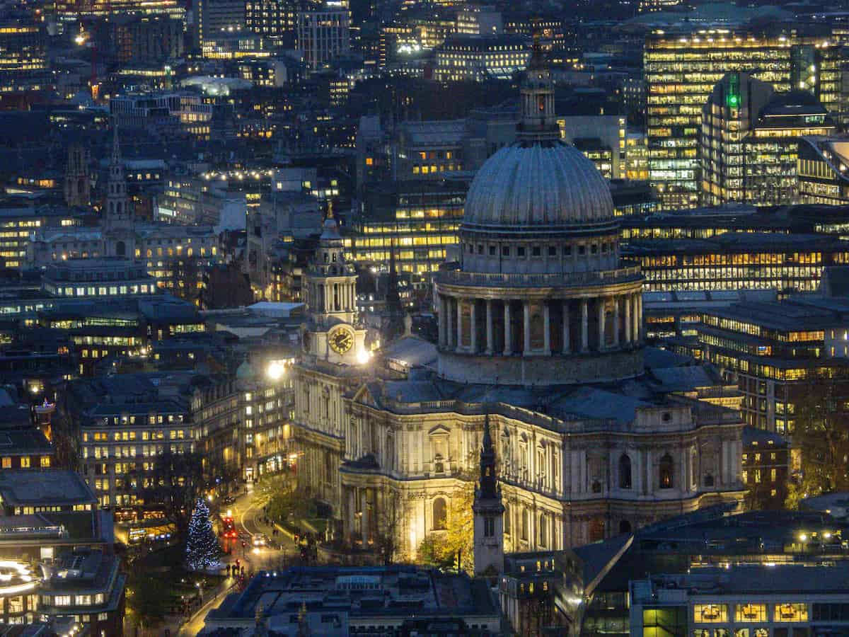 an aerial view of st paul's cathedral at night located within the surrounding city