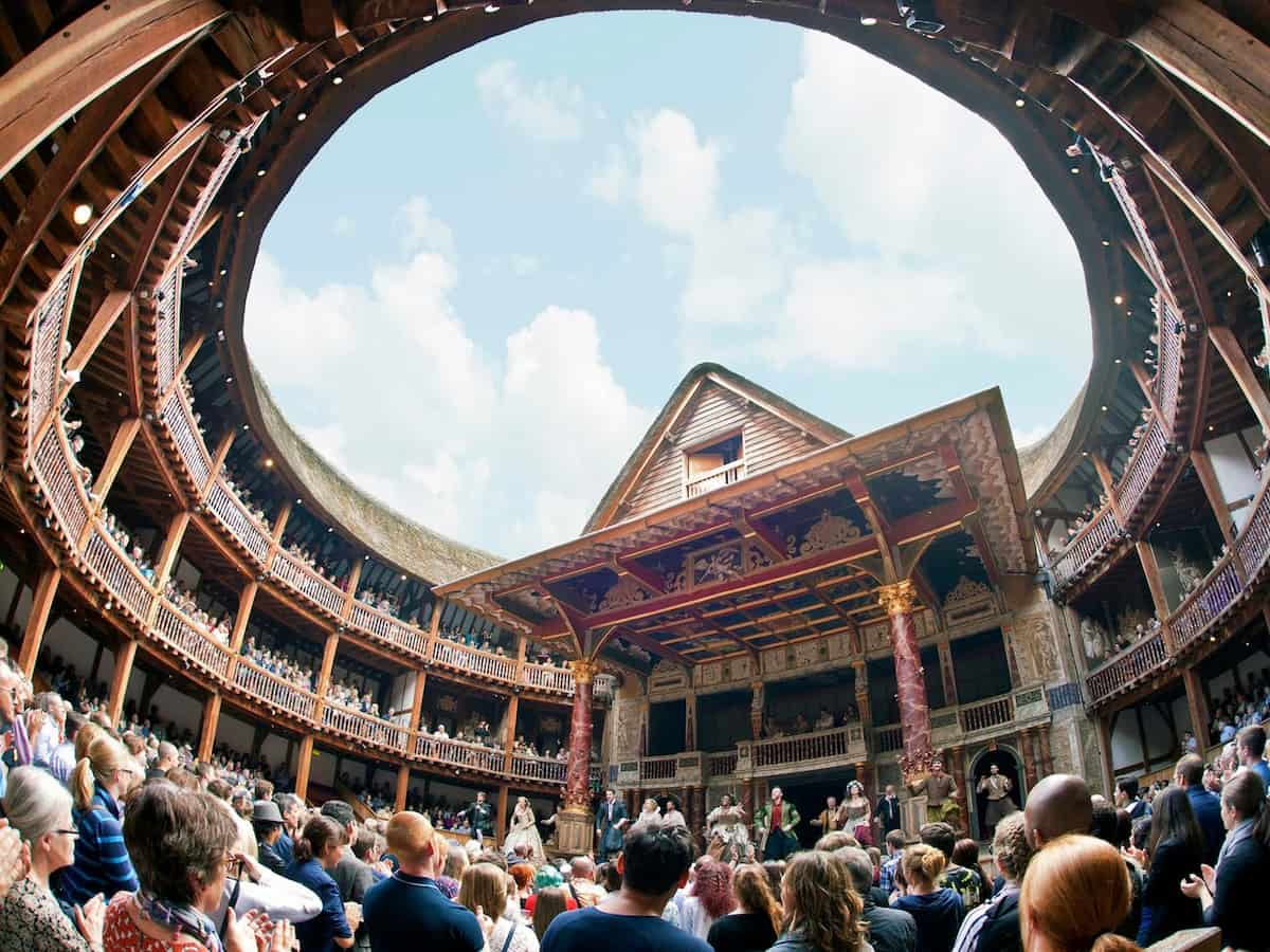 a view from inside the new shakespeare globe theatre looking upward through the open-air roof