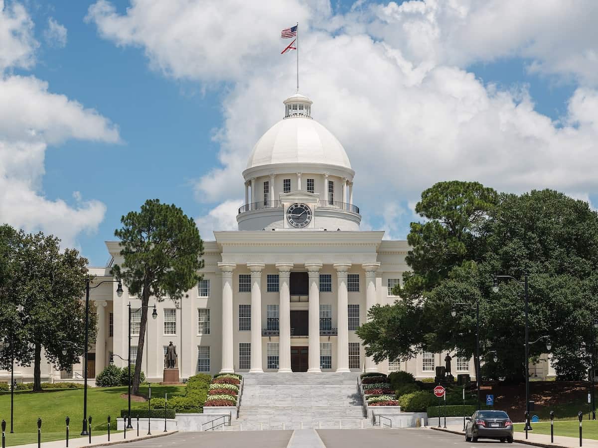 the front of the alabama state capitol on a bright day