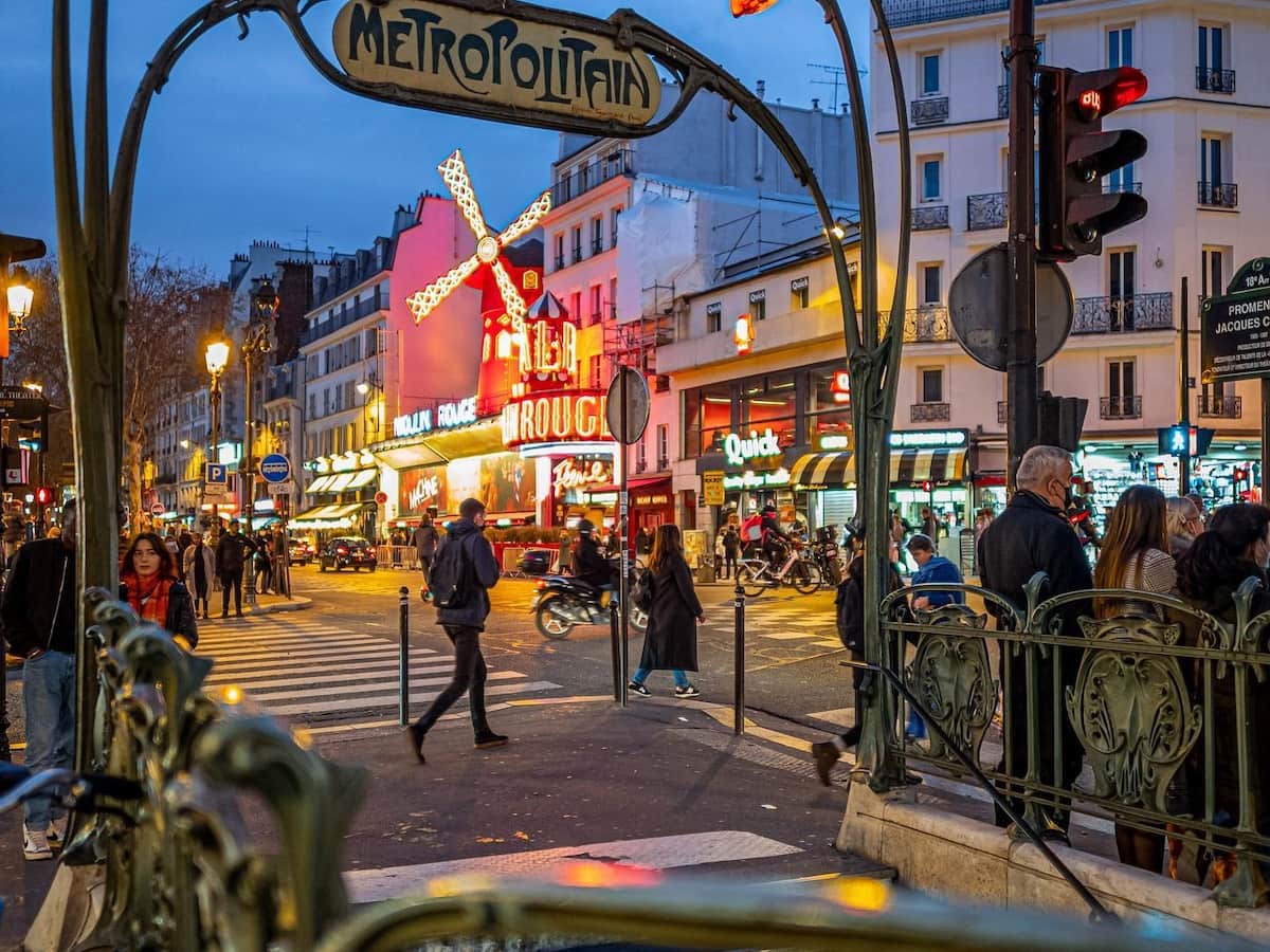 a view of the moulin rouge from the blance metro stop in paris