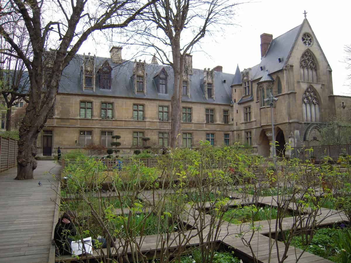 the Musée de Cluny and a courtyard of plants