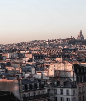 a view of montmartre hill in paris with sacré-cœur on top in the distance