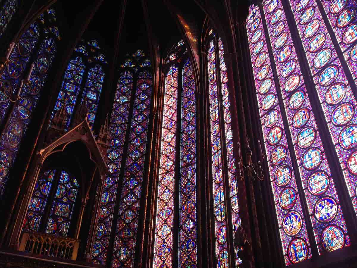 a view of the colorful stain glass windows inside sainte-chapelle church in paris