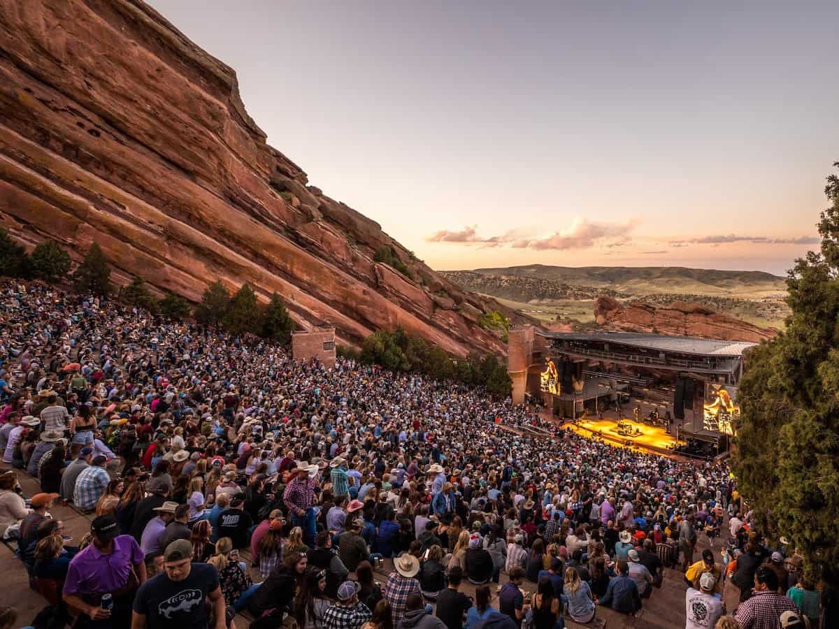 a concert at the red rocks amphitheatre hewn into the rocky mountainside outside of the denver metro area