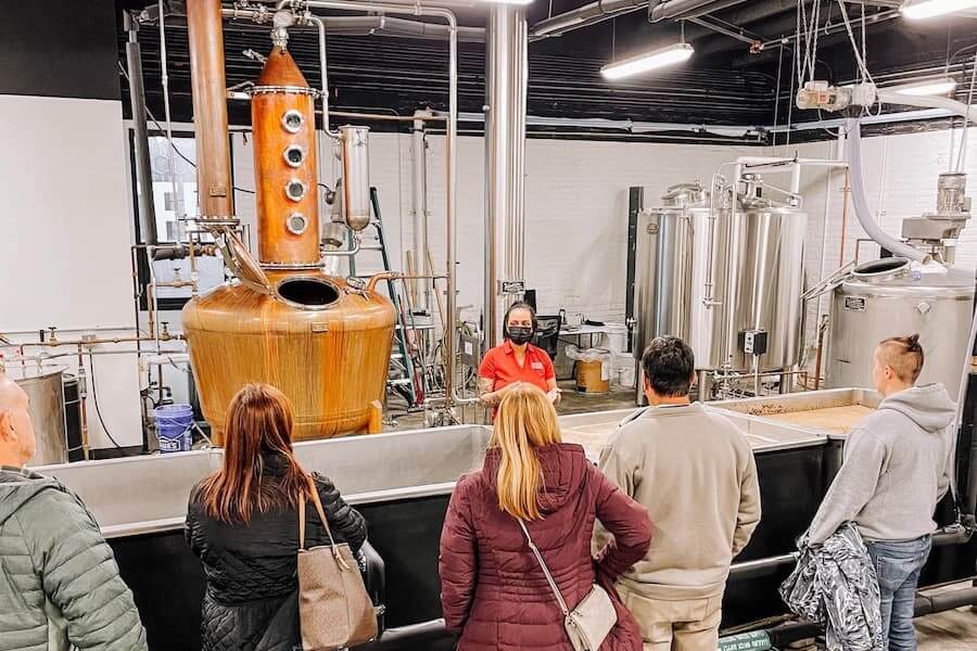 a group on a tour at rock town distillery in little rock