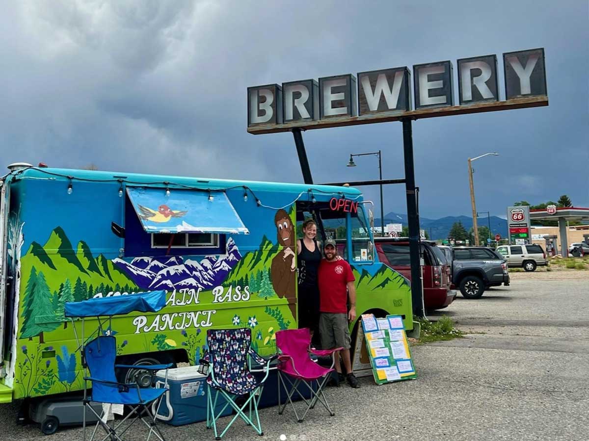 a brewery sign with a food truck at a brewery in salida colorado
