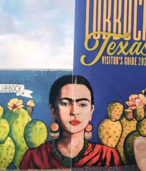a frida kahlo mural on the side of grey edges art gallery in downtown lubbock texas