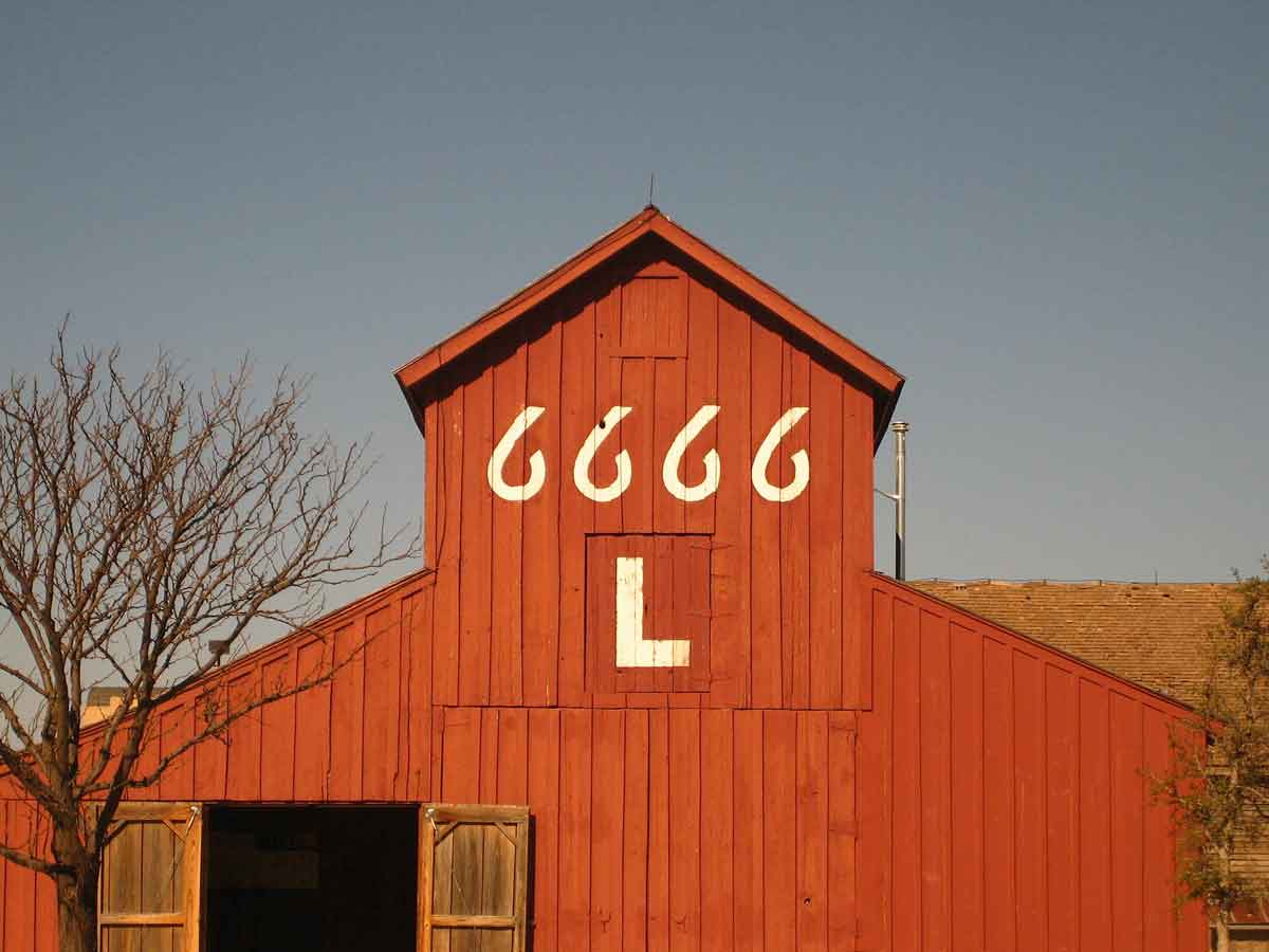 a view of the 6666 red barn at the national ranching heritage center