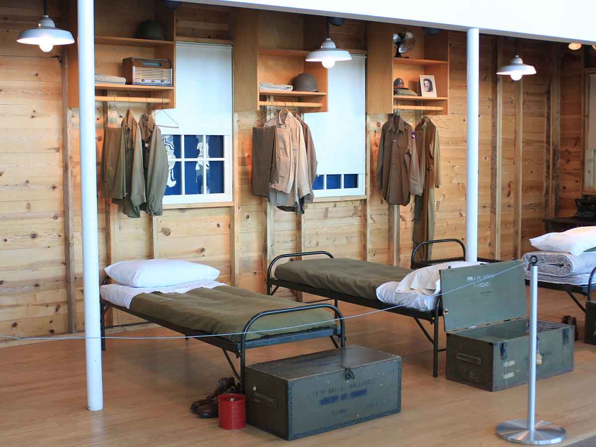 an army barracks display at the silent wings museum