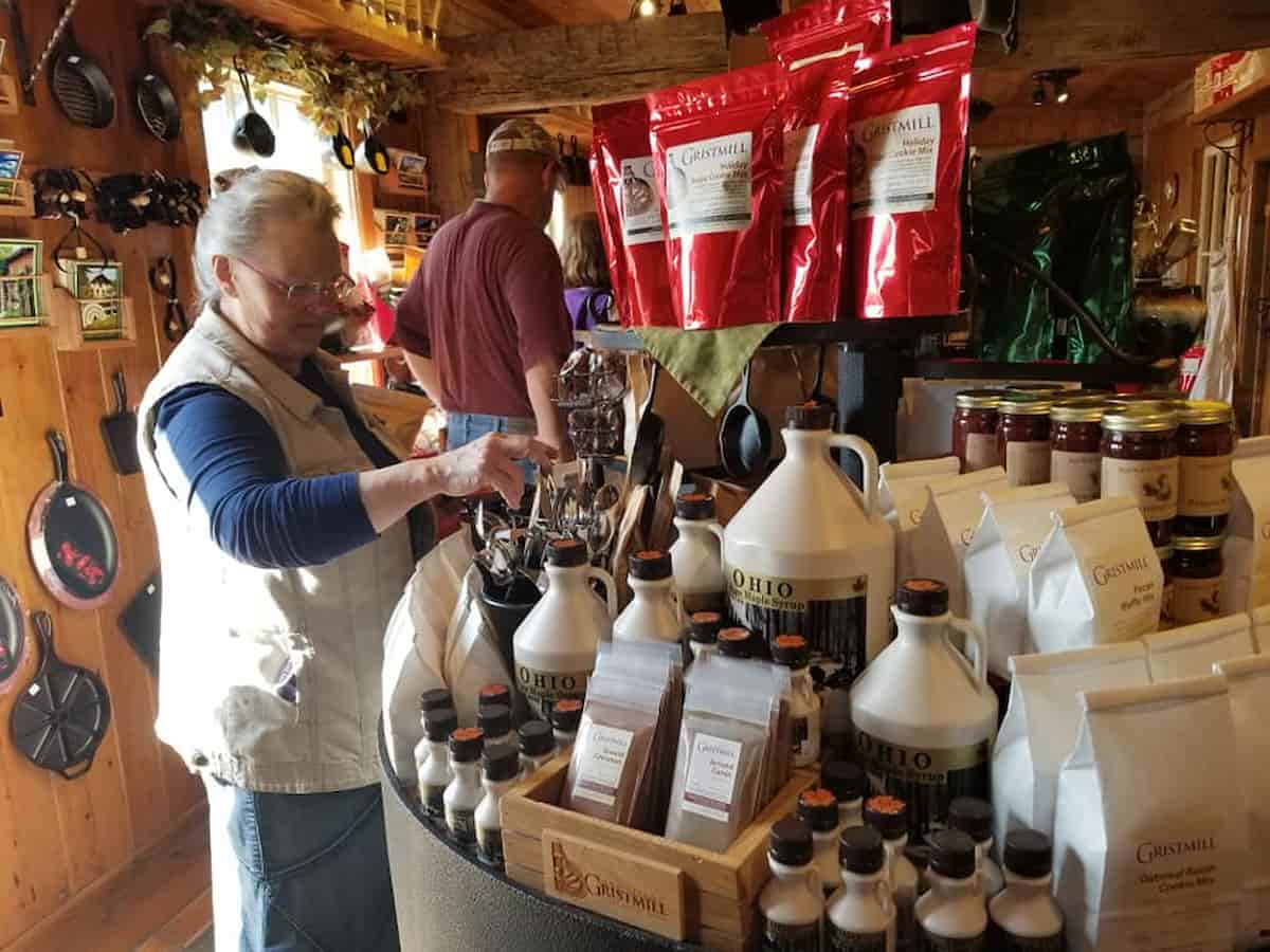 a woman browses items at the homestead craft village