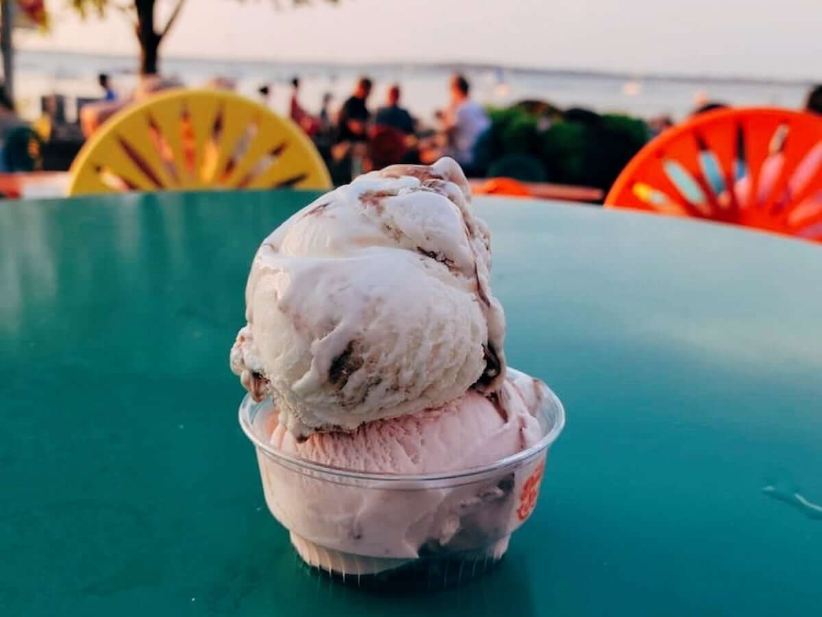 two scoops of ice cream in a cup on a table from babcock dairy store in madison