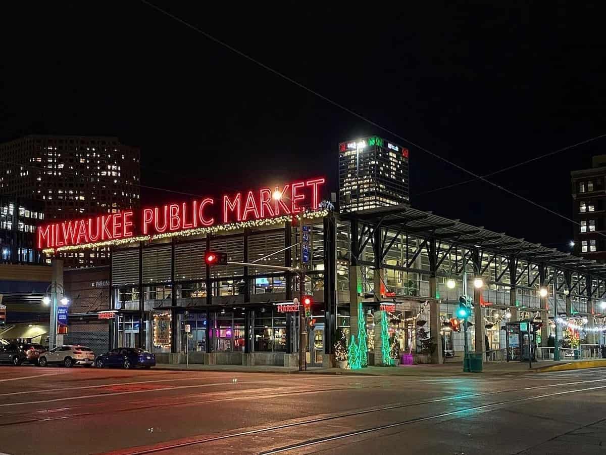 exterior signage of milwaukee public market at night and christmas time