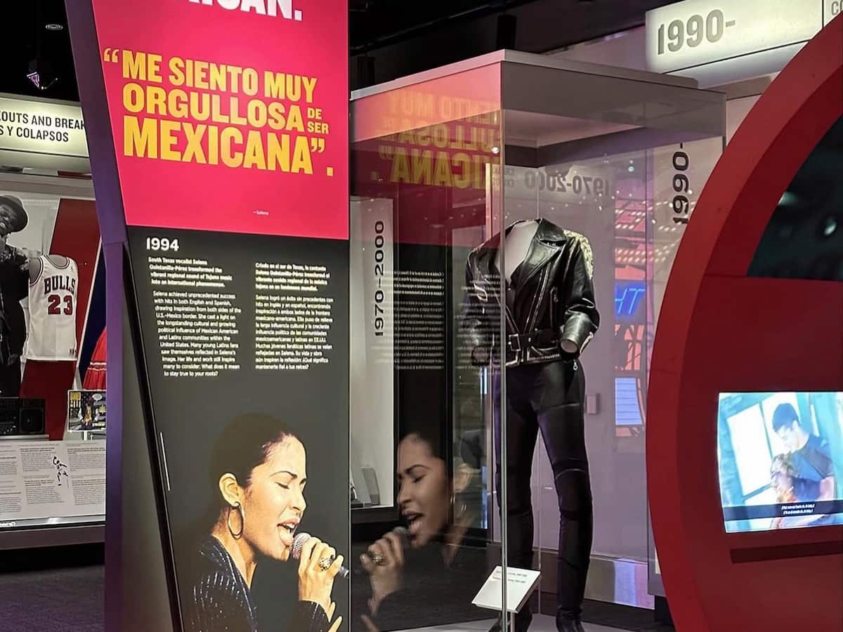 an exhibit at the selena museum showing one of her stage outfits