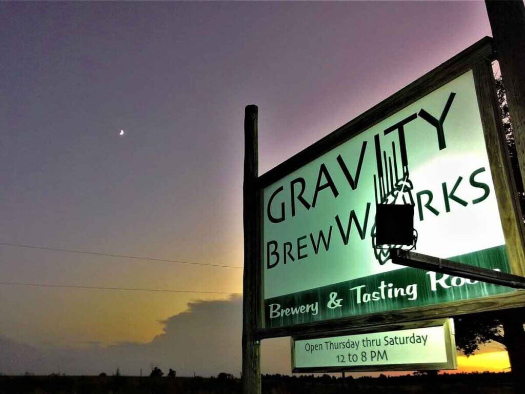 View of Gravity BrewWorks Sign against a twilight sky