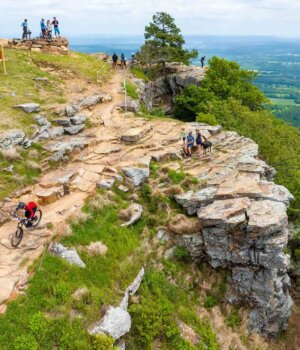 people hiking a trail on mount nebo in arkansas