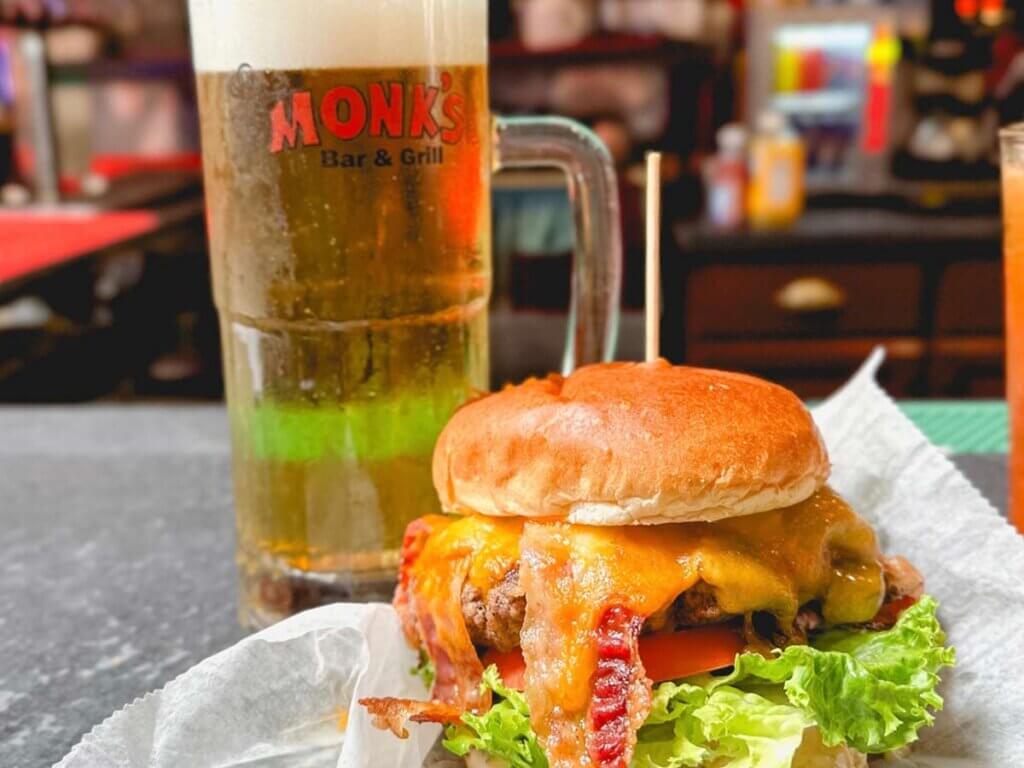 Large burger and beer at Monk’s Bar