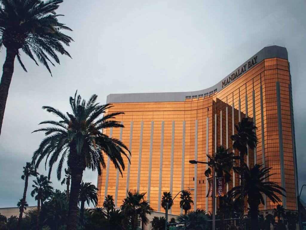 Mandalay Bay Resort and Casino surrounded by palm trees