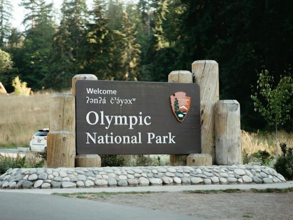 a welcome sign to olympic national park