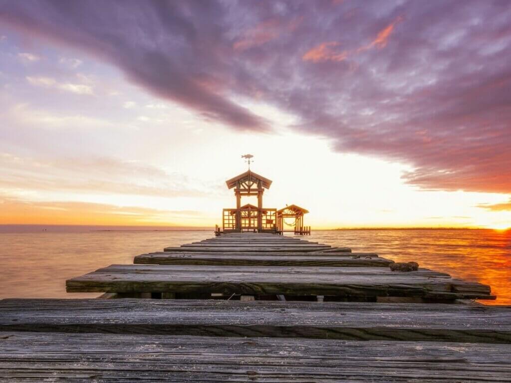 a beautiful sunset in ocean springs mississippi over the gulf of mexico